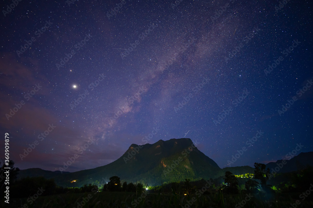 Landscape with colourful bright milky way and mountain. Night sky with stars..
