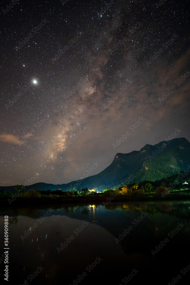Landscape with colourful bright milky way and mountain. Night sky with stars..