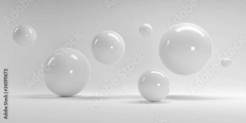 3d rendering of several sized reflected spheres inside a white studio © Anton