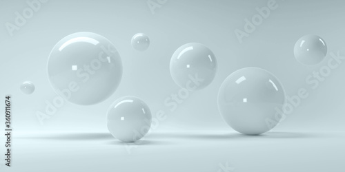 3d rendering of several sized reflected spheres inside a blue studio © Anton