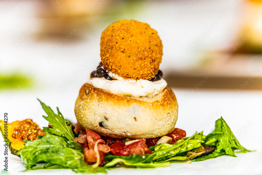 Fried meatball with herb sauce and potato on plate. The food in the restaurant. Food styling and restaurant meal serving. Fried meatball with herb sauce and potato on plate. The food in the restaurant. Food styling and restaurant meal serving.