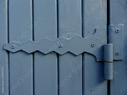 A close up photo of the joint of a wooden window shutter. 
