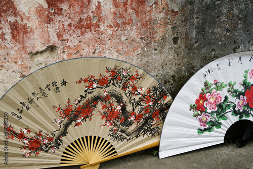 Photography Large, hand-painted, decorative fans for sale outside a shop in Fuli, Guangxi Pr