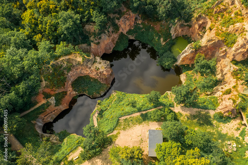 Flooded ancient stone quarry in Hungary near Sarospatak. Megyer-hegyi tengerszem. Small lake at the top of a hill. View from the top. Fantastic nature attraction in Tokaj area. photo