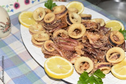 Fried Squid Rings With Lemon in the Plate