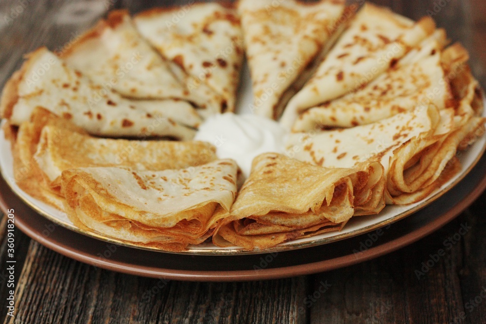 Delicious fresh crepe with sour cream macro Delicious fresh crepe with sour cream macro