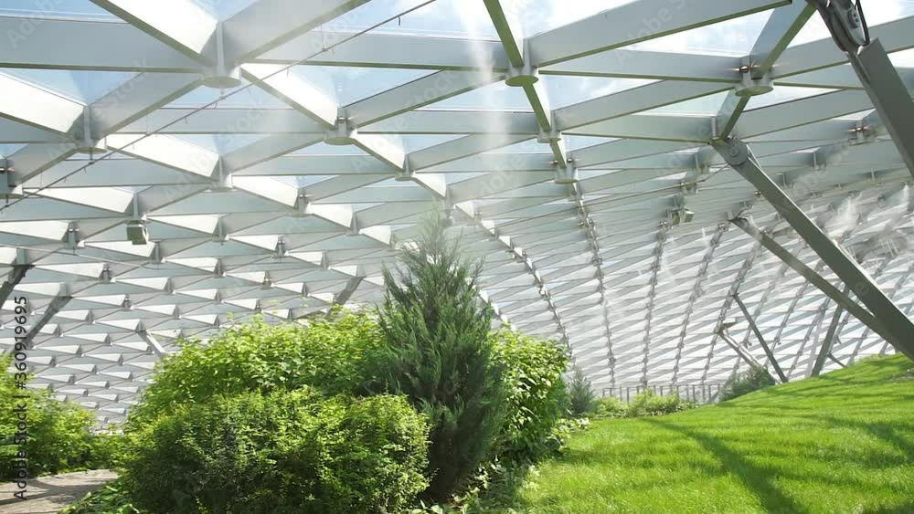 humidifier cooling spray over plants and shrubs with an interesting dome humidifier cooling spray over plants and shrubs with an interesting dome