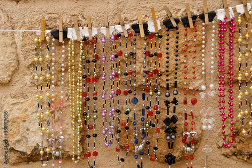 Bead necklaces for sale by street vendor, Midyat, Eastern Anatolia, Turkey photo