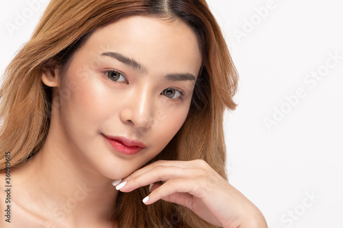 Beautiful Asian woman look at camera smile with clean and fresh skin