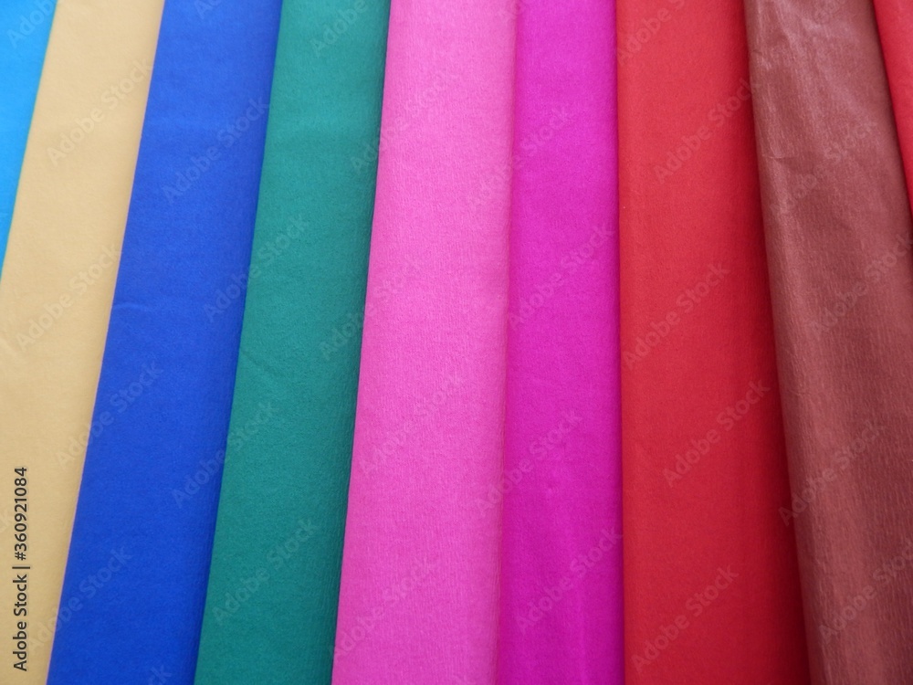 Rolls of colourful fabric texture