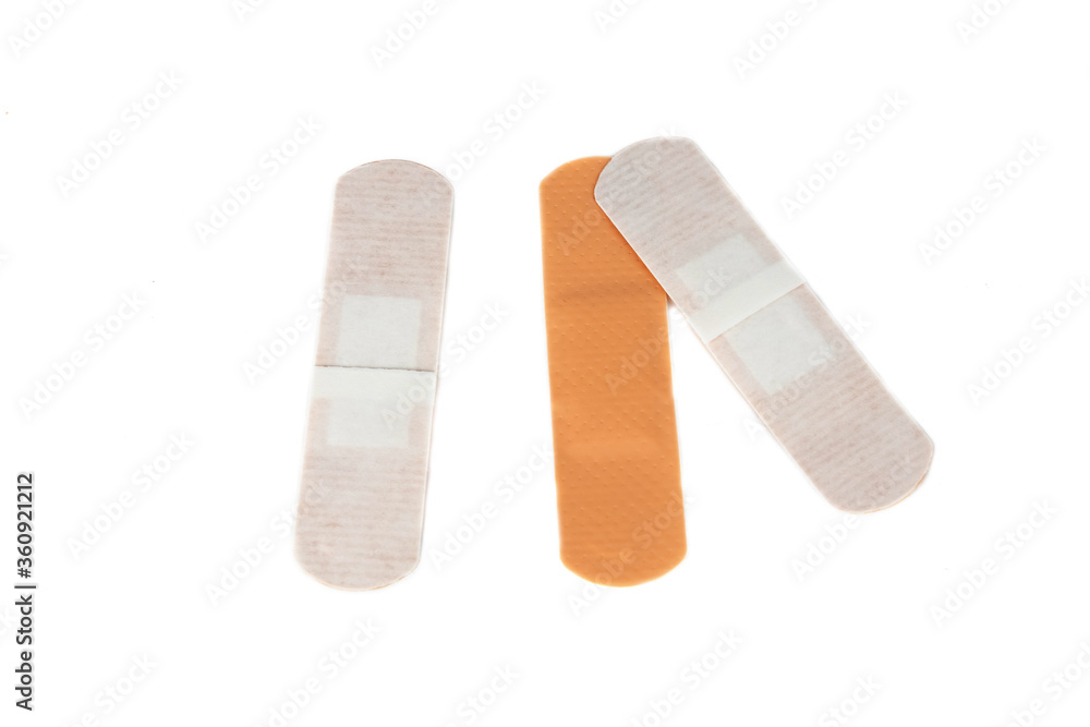 Adhesive plaster isolated on white background. Healing wounds, scratches, sadin. Adhesive plaster isolated on white background. Healing wounds, scratches, sadin.
