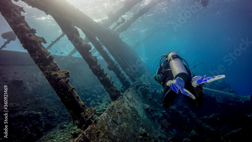 The diver flies over the huge deck of the sunken ship. Port Sudan (Sudan)
