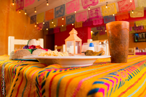 MEXICAN FOOD, CHILLI STUFFED WITH CHEESE WITH RICE AND REFRITED BEANS IN A MEXICAN RESTAURANT