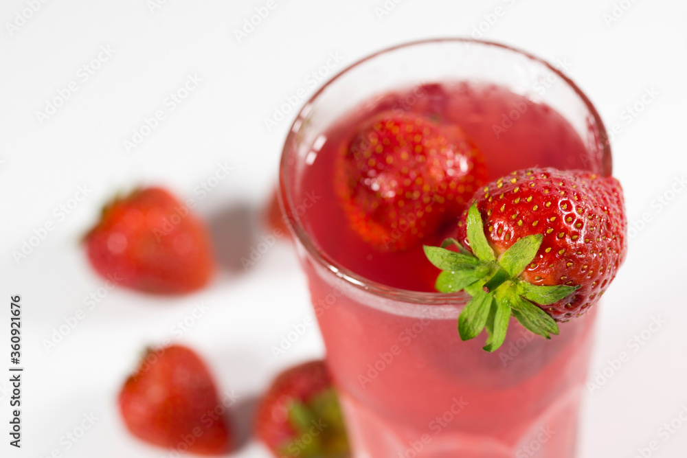Fresh strawberry cocktail. Fresh fruit summer lemonade with strawberries and ice cubes. Fresh strawberry cocktail. Fresh fruit summer lemonade with strawberries and ice cubes.