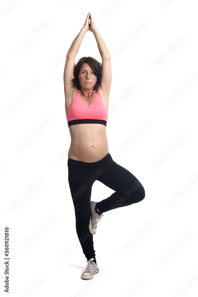 pregnant woman doing exercises on white background