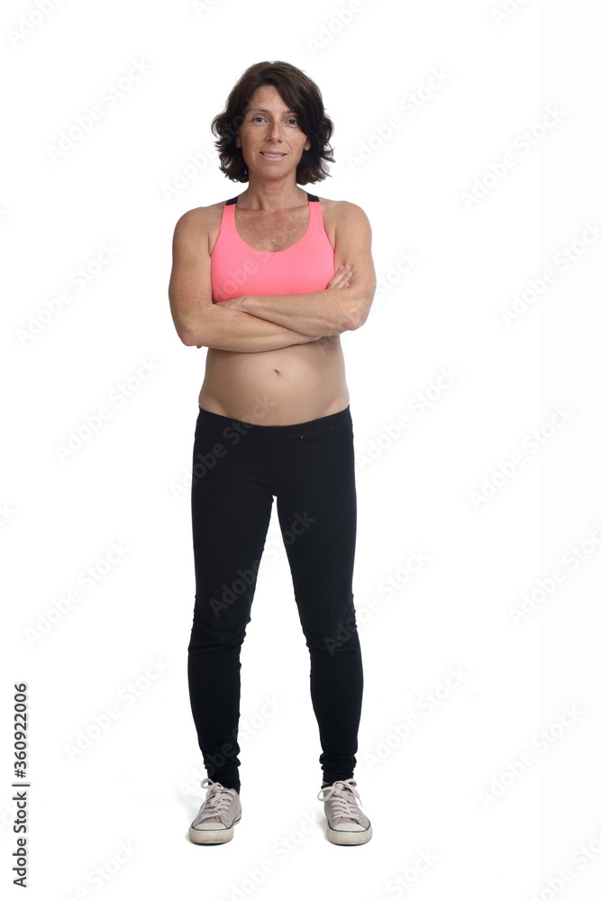 pregnant woman with sportswear isolated on white background, looking at camera arms crossed pregnant woman with sportswear isolated on white background, looking at camera arms crossed