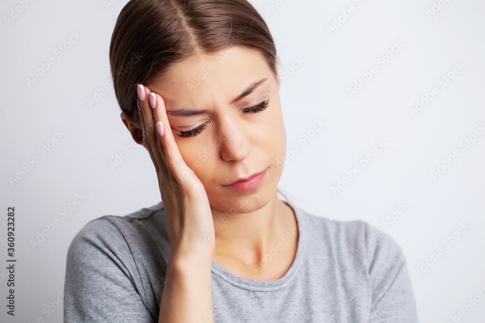Head pain, exhausted young woman has suffering from unbearable headache Head pain, exhausted young woman has suffering from unbearable headache