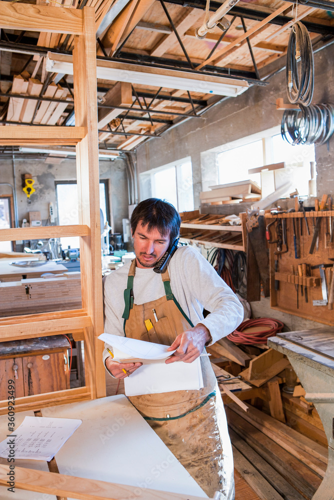male woodworker in his woodworking shop male woodworker in his woodworking shop