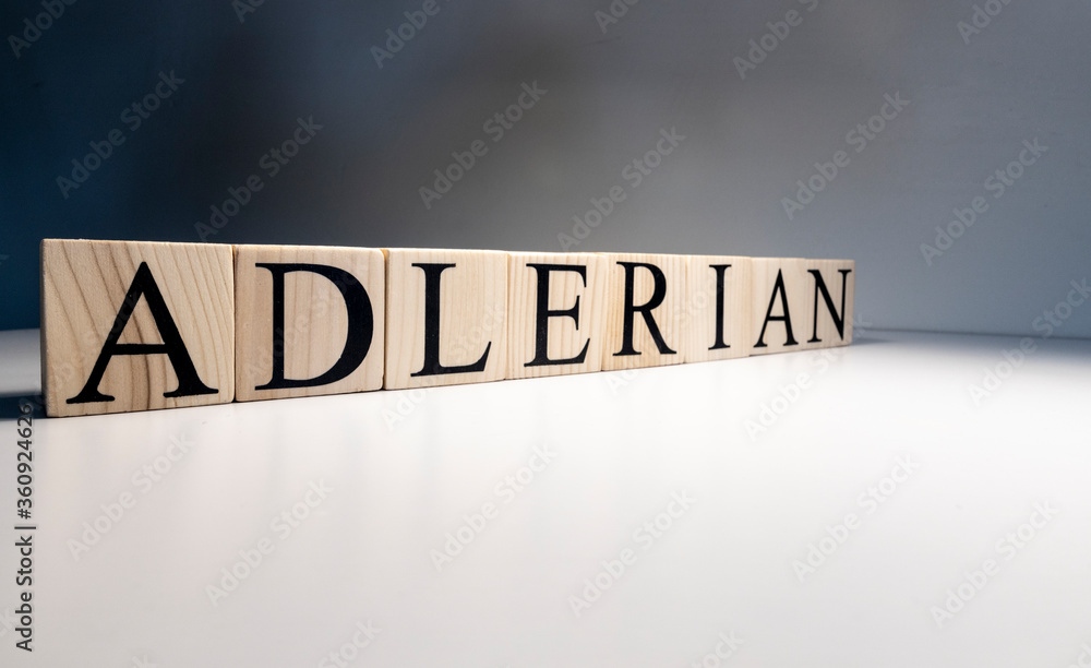 Adlerian psychology text from wooden cubes. Close up. Adlerian psychology text from wooden cubes. Close up.
