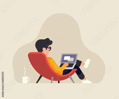 Relaxed man in a lounge chair working on a laptop. Stress free job vector concept illustration with male character working from home or other comfortable place