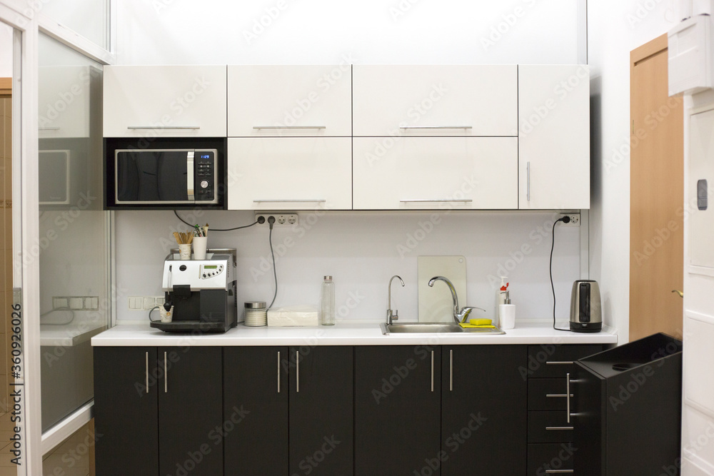 Office kitchen interior. Shared kitchen in the office Office kitchen interior. Shared kitchen in the office