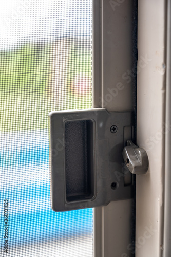 Interior sliding screen door hardware and flip latch