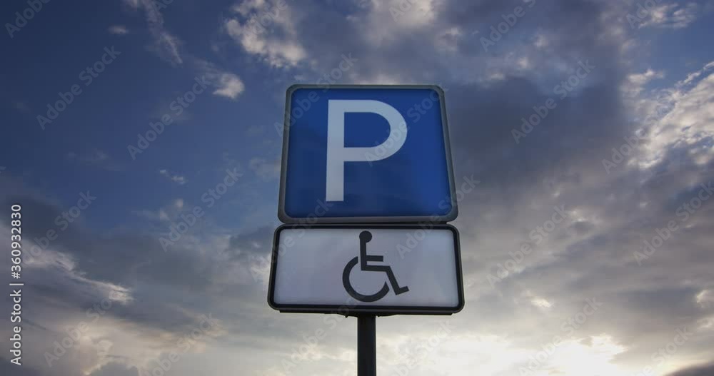 Disabled parking sign on a background of clouds. Disabled parking sign on a background of clouds.