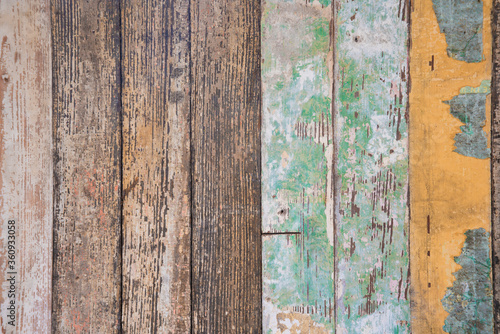 Colorful mix of old, painted wooden wainscotting with rough texture and a grungy vintage look © Judy