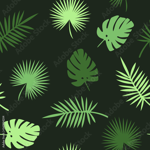 Seamless green jungle leaves pattern on dark green background