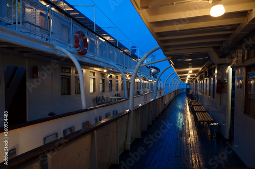 Two motor ships moored side by side. Twilight on the river