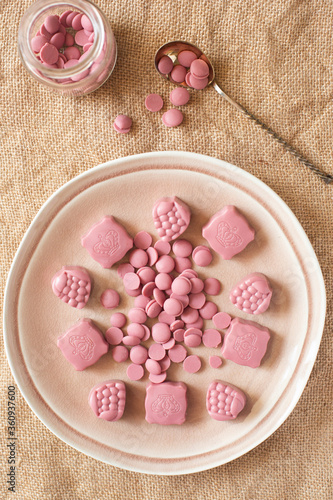 On a burlap of pink chocolate candy.
