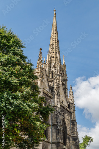 Bell Tower of Saint Michael Basilica of Bordeaux, France. Partial view, vertical photo.