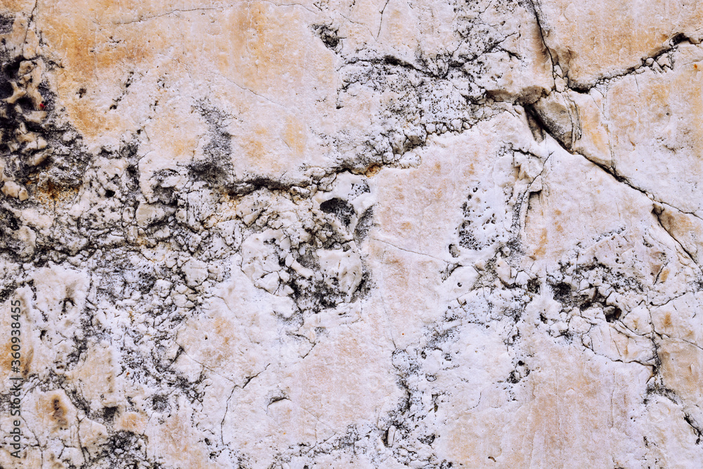 Marble stone wall, cement wall cracked and uneven, weathered wall with space for text, no person and horizontal
Marble stone wall, cement wall cracked and uneven, weathered wall with space for text, no person and horizontal