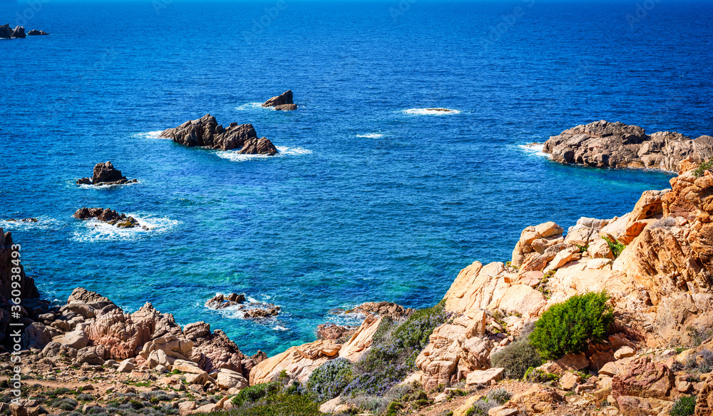 Rocks and blue sea in Costa Paradiso shore on a sunny day Rocks and blue sea in Costa Paradiso shore on a sunny day