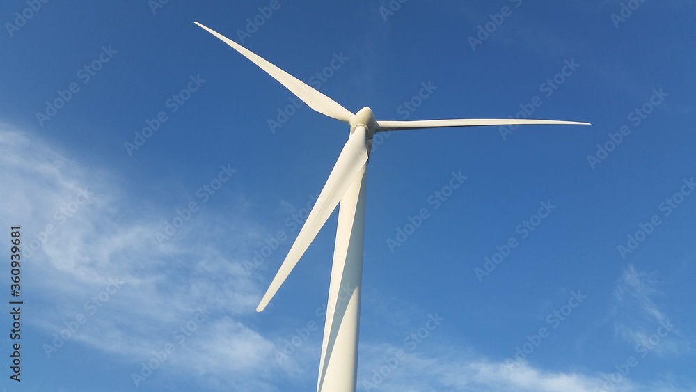 Fototapeta premium wind turbine against blue sky