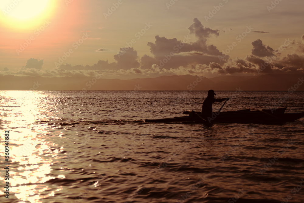 silouhette of boat at sunset