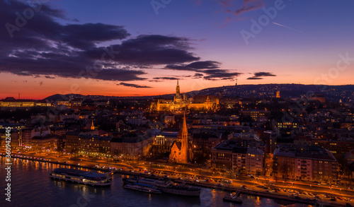 Aerial drone of lighted Matthias Church on Buda hill during Budapest sunset