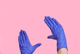 Hands in medical gloves show a frame, a frame from hands, measure something.
