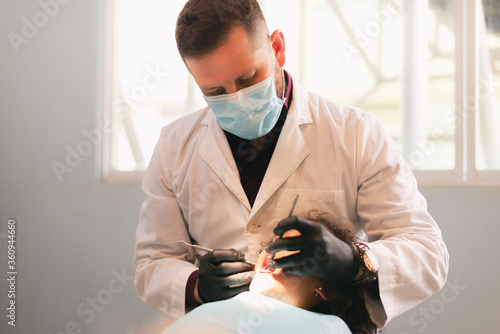 dentist attending girl, integral attention in dentistry in clinic