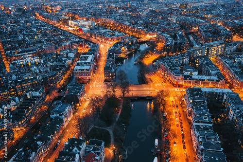 Canvas Print Amsterdam city skyline at night, aerial view, Amsterdam, Netherlands, drone photo