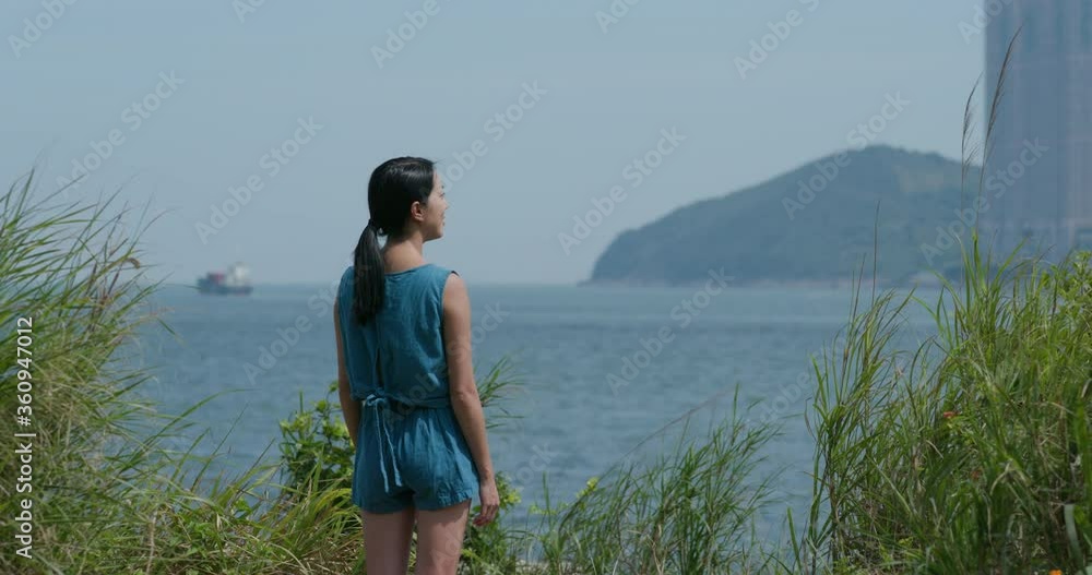 Woman look around the sea in forest Woman look around the sea in forest