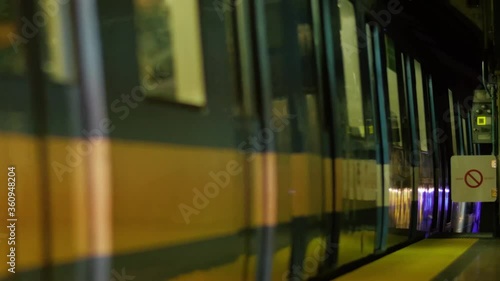 Montreal, QC, Canada - November 15, 2017: train wagons passing at slow speed while leaving Rosemont subway metro station toward the underground tunnel