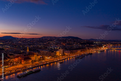 Aerial drone shot of Danube riverbank Buda hill side during Budapest sunset hour © Davidzfr