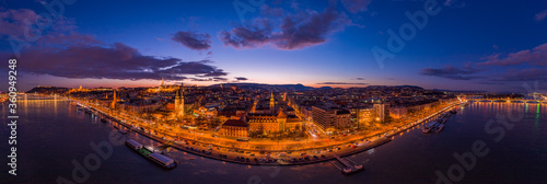 Panoramic aerial drone of lighted Matthias Church on Buda hill during Budapest sunset