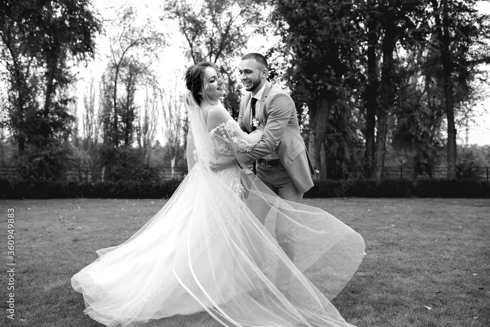 wedding couple walks in the park and dances, the bride and groom have fun wedding couple walks in the park and dances, the bride and groom have fun
