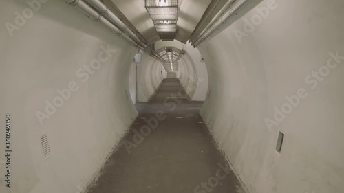 Montreal, QC, Canada - November 15, 2017: Walking on pedestrian underground tunnel that linking Gare Pine Beach, Autoroute 20 and Herron Road. photo