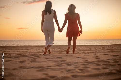 Los Cabos   Mexico- Feb 2019 Lesbian Love concept  sunset Lesbian  adjective to characterize or associate nouns with female homosexuality or same-sex attraction.