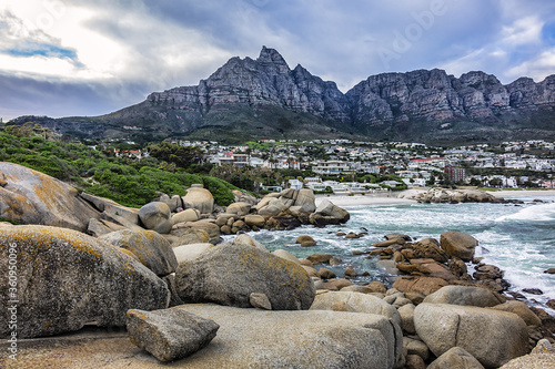 Wonderful Camps Bay nature (Kampsbaai) before sunset - affluent suburb of Cape Town. Camps Bay bordered by spectacular Twelve Apostles Mountain and glittering Atlantic Ocean. Camps Bay, South Africa.