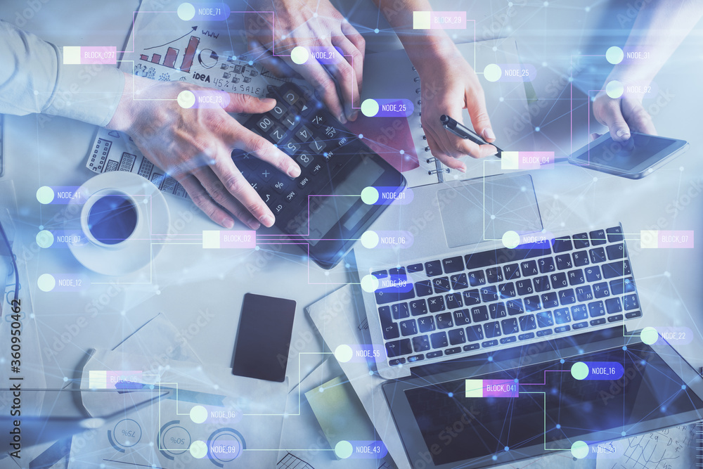 Double exposure of man and woman working together and data theme hologram drawing. Computer background. Top View. Double exposure of man and woman working together and data theme hologram drawing. Computer background. Top View.