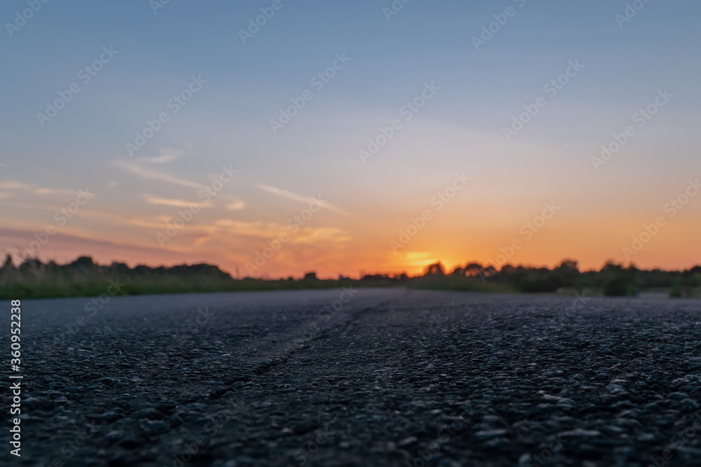 Landscape nature empty road street with green plant under sunset background change to gold natural light color of beautiful grass wheat meadow prairie field in summer sun clear sky
